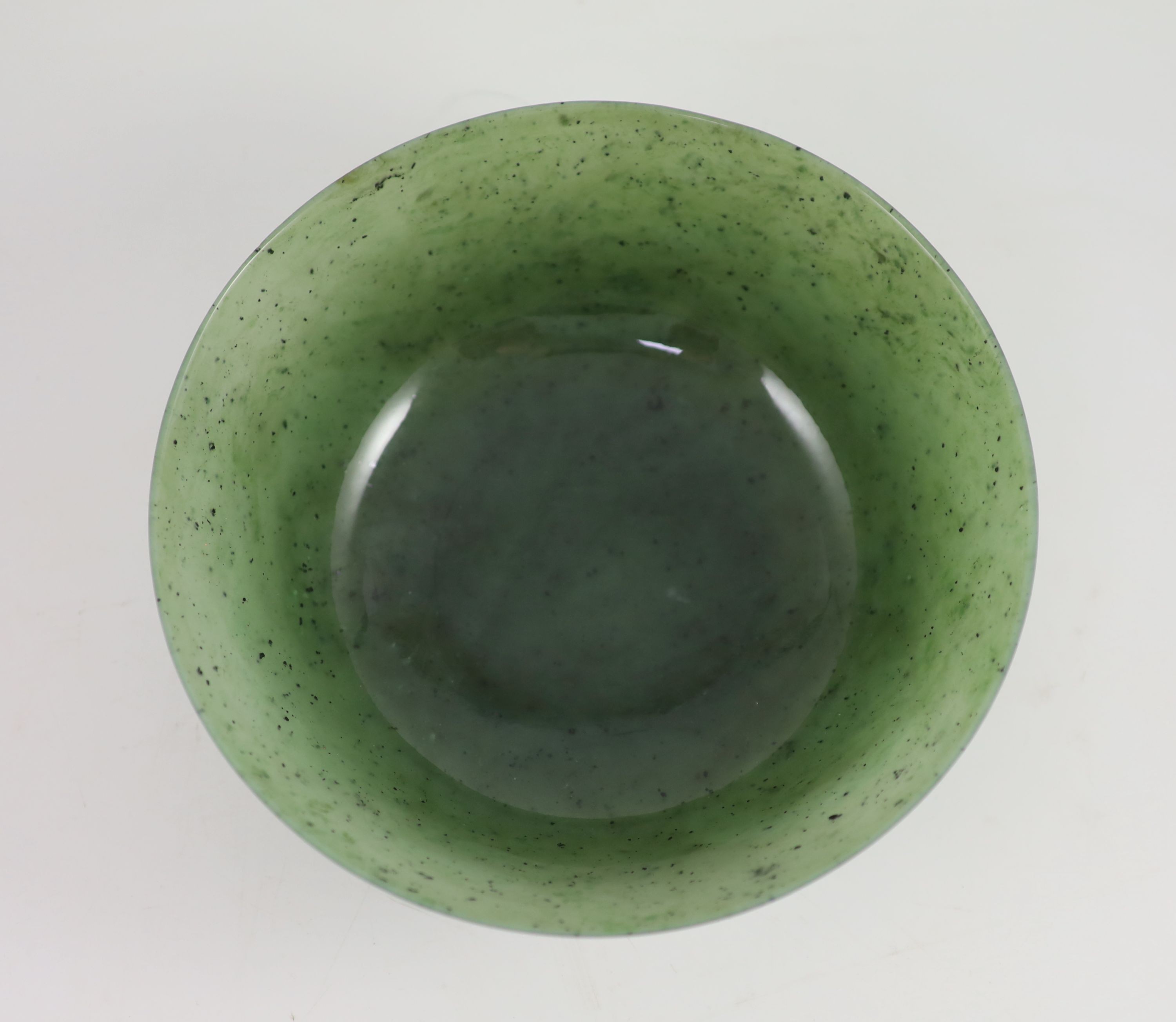 A Chinese spinach green jade bowl, 19th century 22 cm diameter